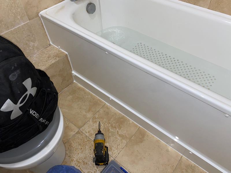 New bath panel installation with leak test by Magico Plumbing And Heating in Hampstead