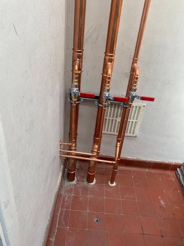 Copper pipework with isolation valves fitted by Magico Plumbing And Heating in Chigwell