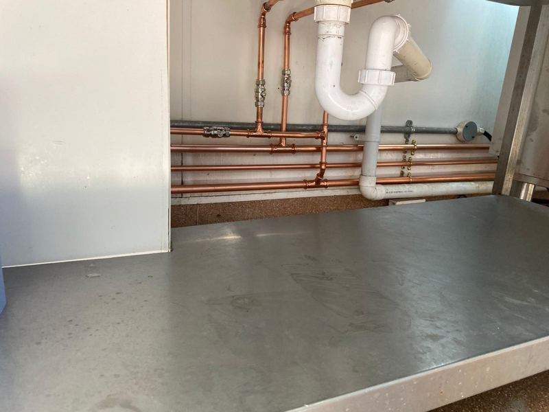 New copper pipework installation under kitchen counter by Magico Plumbing And Heating in Chigwell