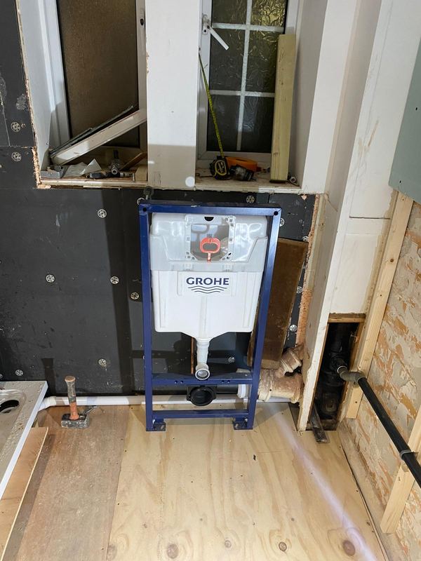 GROHE concealed cistern installation during bathroom renovation by Magico Plumbing And Heating in Chelsea and Kensington