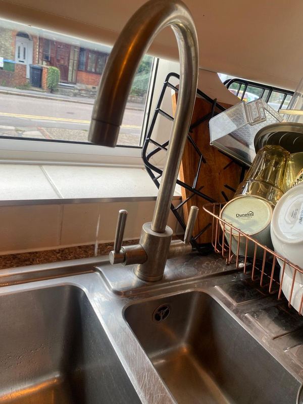 Worn kitchen mixer tap before replacement by Magico Plumbing And Heating