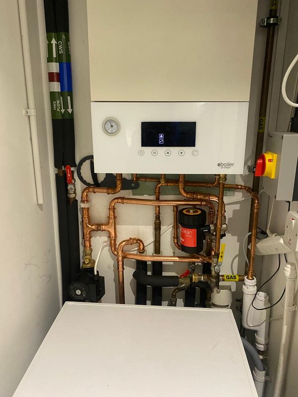 Strom eBoiler electric boiler installation with copper pipework by Magico Plumbing And Heating in Chelsea and Kensington